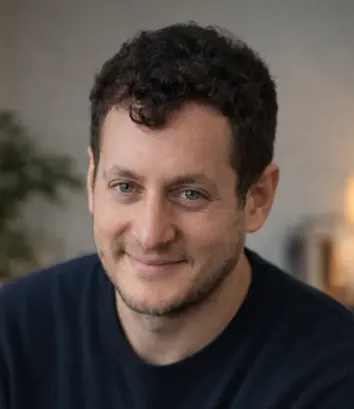 Dr. Walid Messaoudi, smiling, in a dark sweater.